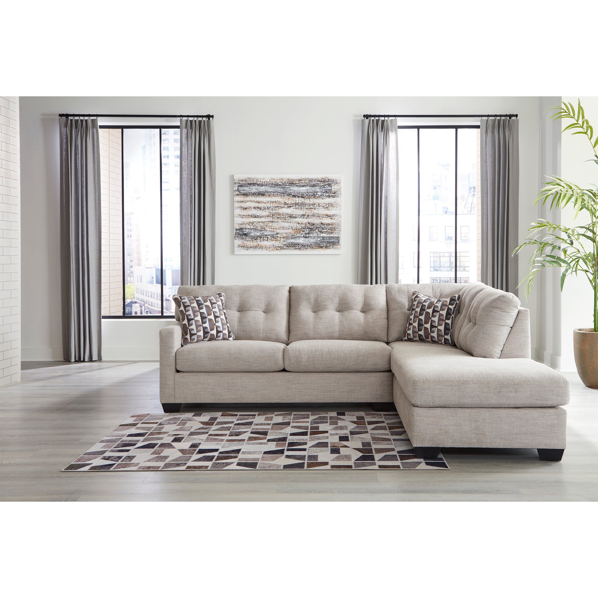 Pebble-colored Mahoney Sectional with plush chaise, a luxurious addition to Milwaukee living spaces