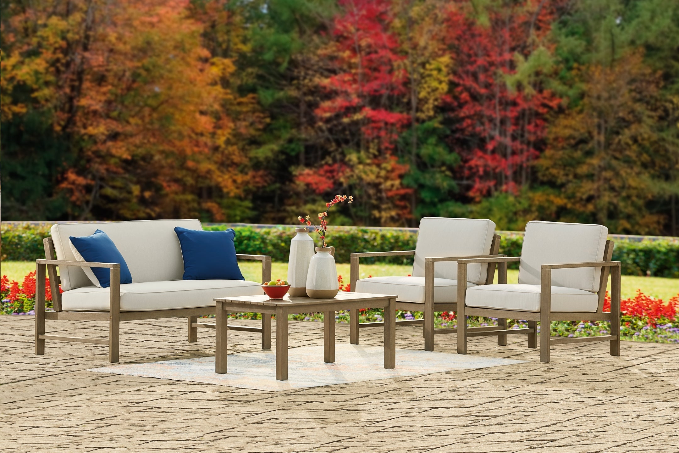 Fynnegan Outdoor Loveseat and 2 Chairs with Coffee Table